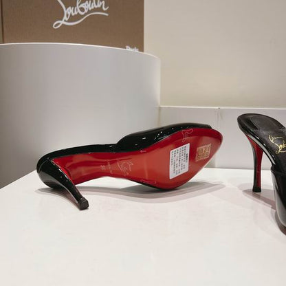 ARCHITECTURAL BLACK OPEN-TOE HIGH-HEEL MULES WITH SLEEK SLIP-ON SILHOUETTE AND POLISHED FINISH