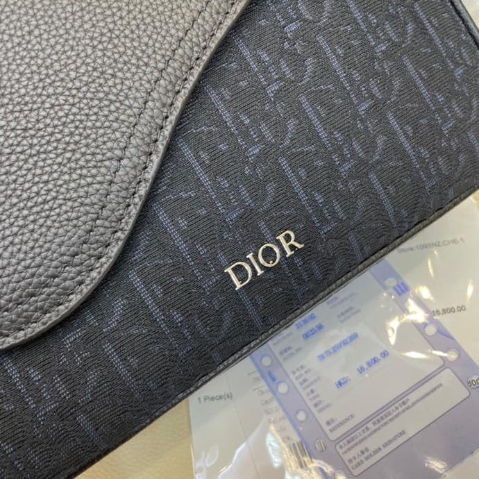 PREMIUM TEXTURED FABRIC AND LEATHER CROSSBODY BAG WITH REFINED COWHIDE HARDWARE