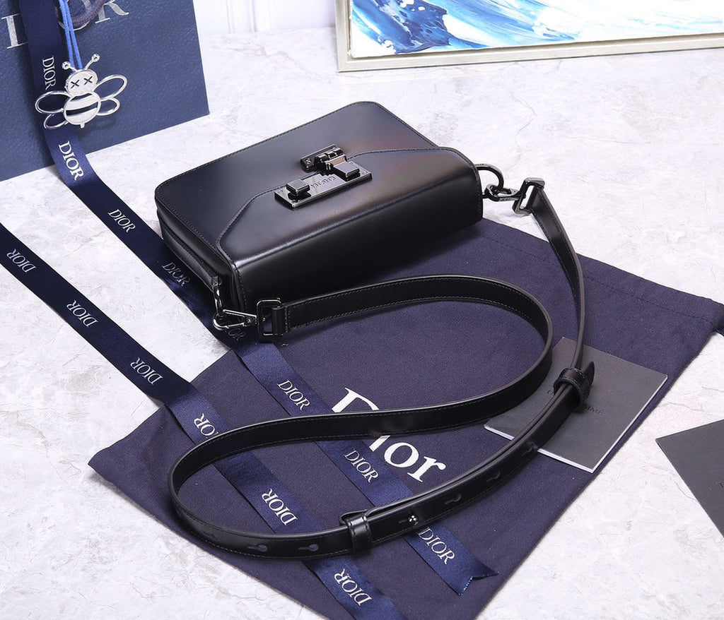 PREMIUM TEXTURED FABRIC AND LEATHER CROSSBODY BAG WITH REFINED COWHIDE HARDWARE