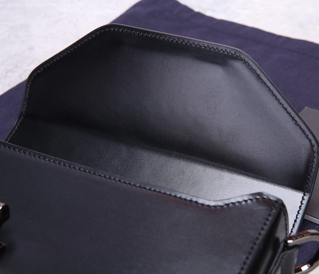 PREMIUM TEXTURED FABRIC AND LEATHER CROSSBODY BAG WITH REFINED COWHIDE HARDWARE