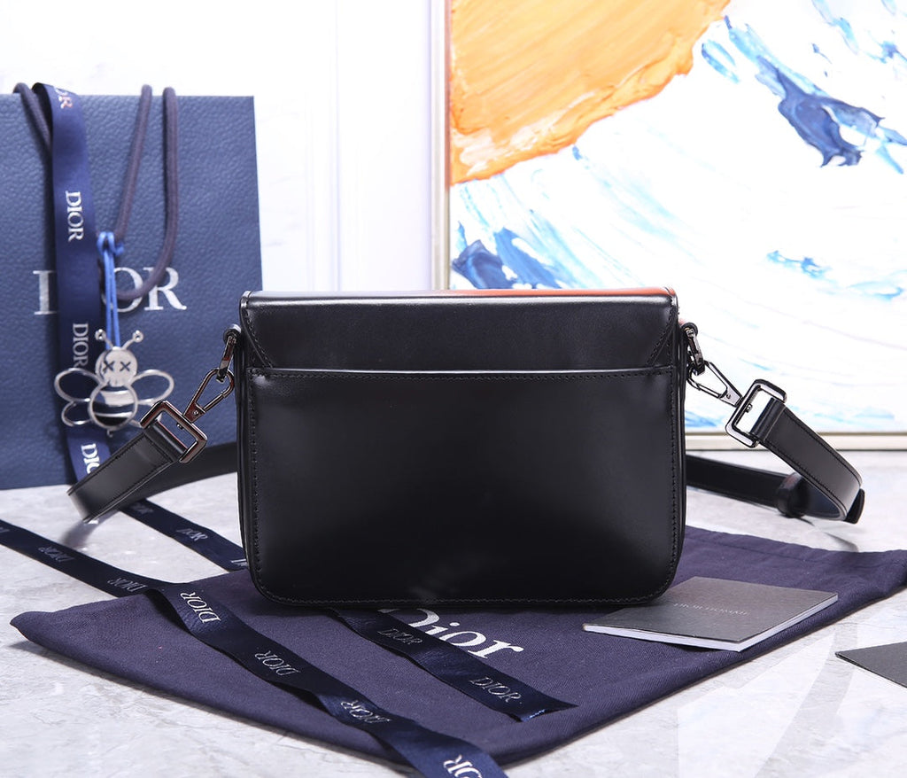 PREMIUM TEXTURED FABRIC AND LEATHER CROSSBODY BAG WITH REFINED COWHIDE HARDWARE