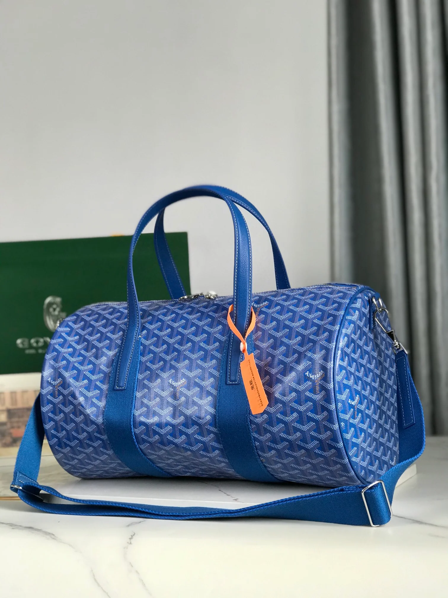 ROYAL AZURE CHEVRON BARREL DUFFEL WITH MONOCHROMATIC LEATHER ACCENTS