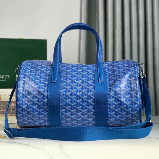 ROYAL AZURE CHEVRON BARREL DUFFEL WITH MONOCHROMATIC LEATHER ACCENTS