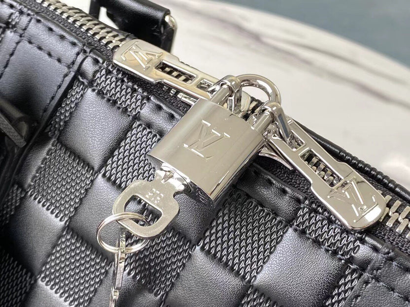 PREMIUM CHECKERED EBONY TRAVEL DUFFEL WITH REINFORCED LEATHER TRIM