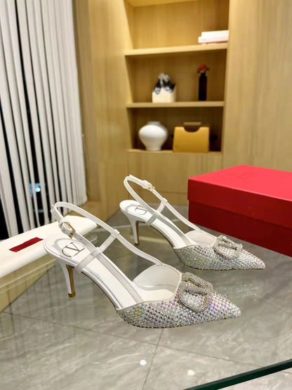 ELEGANT POINTED-TOE PUMPS WITH SCULPTURAL V-SHAPED BUCKLE AND GENUINE SHEEPSKIN LEATHER FINISH