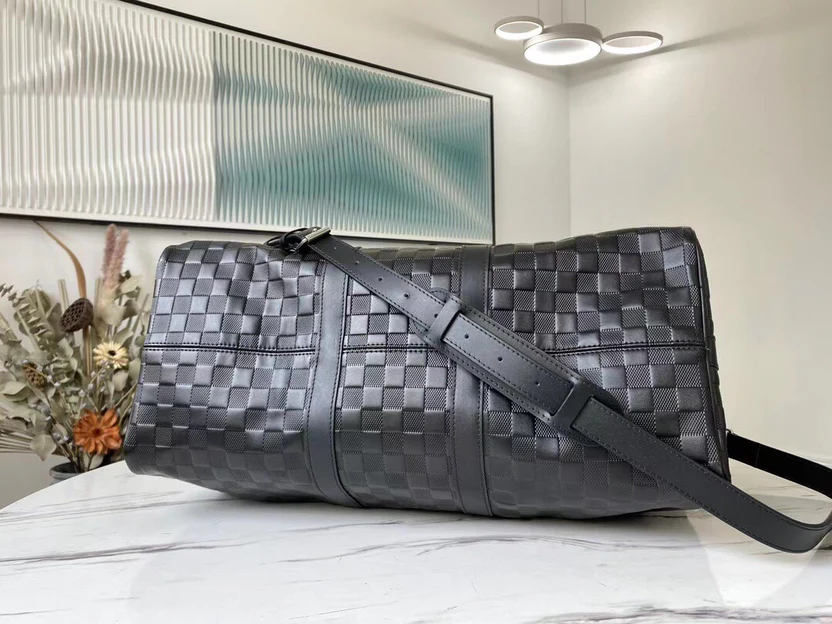 PREMIUM CHECKERED EBONY TRAVEL DUFFEL WITH REINFORCED LEATHER TRIM