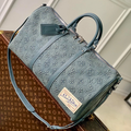 URBAN DENIM MONOGRAM EXPEDITION DUFFEL WITH EMBOSSED TEXTURE AND AZURE LEATHER TRIM