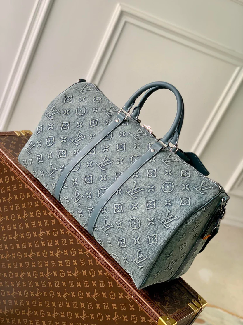 URBAN DENIM MONOGRAM EXPEDITION DUFFEL WITH EMBOSSED TEXTURE AND AZURE LEATHER TRIM