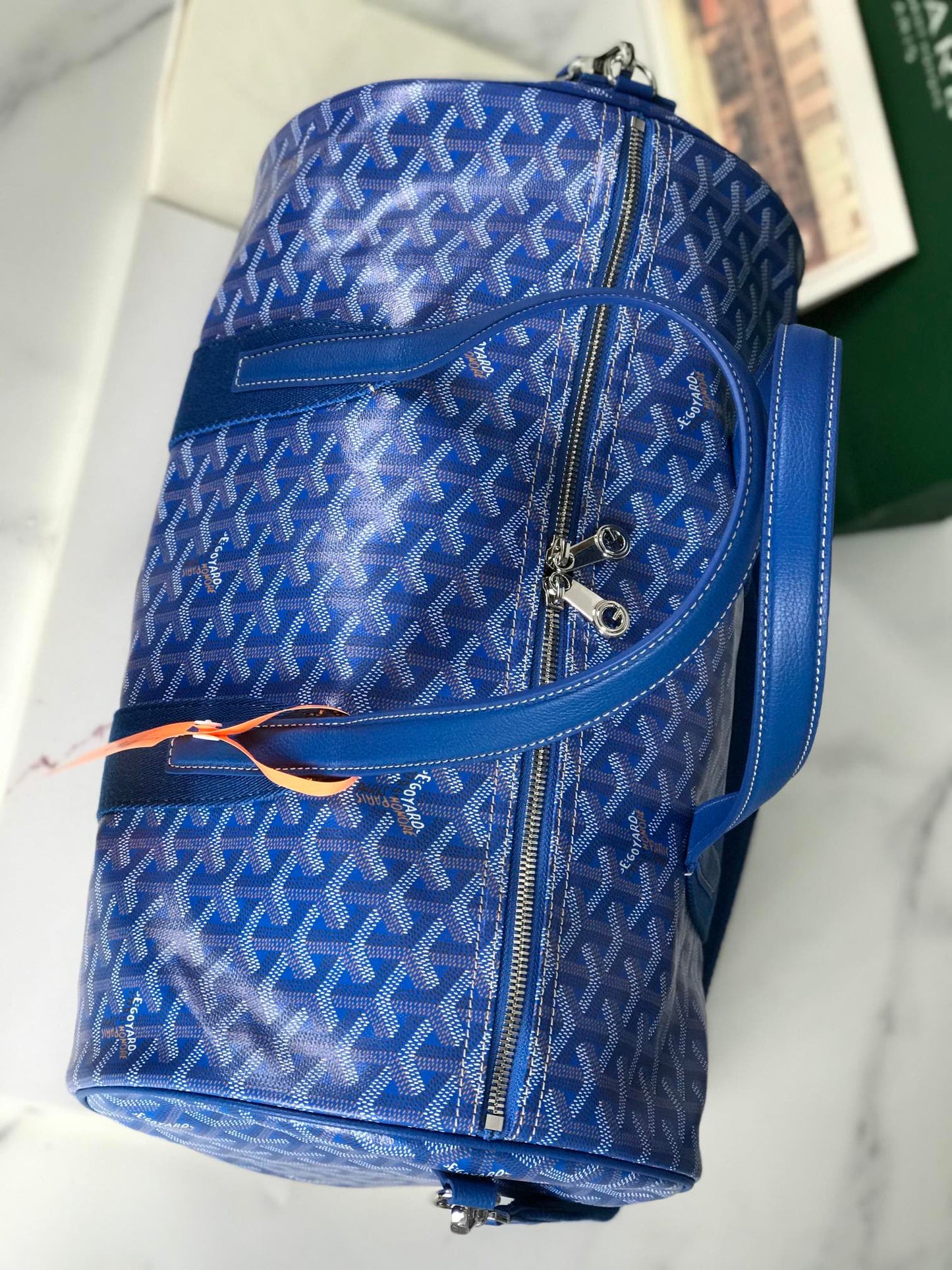 ROYAL AZURE CHEVRON BARREL DUFFEL WITH MONOCHROMATIC LEATHER ACCENTS
