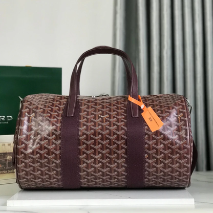 ARTISAN CHEVRON MONOGRAM BARREL DUFFEL WITH DEEP BURGUNDY ACCENTS