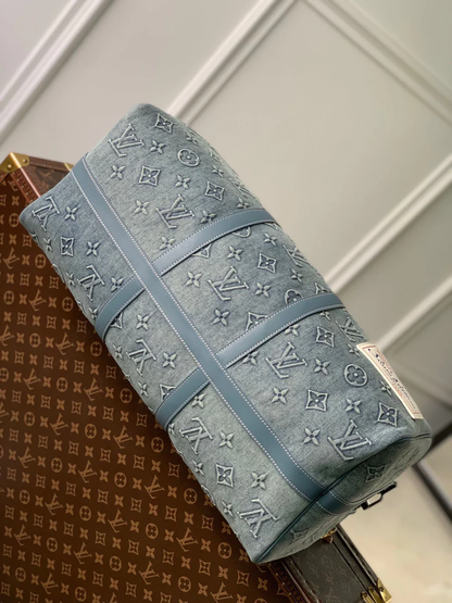 URBAN DENIM MONOGRAM EXPEDITION DUFFEL WITH EMBOSSED TEXTURE AND AZURE LEATHER TRIM