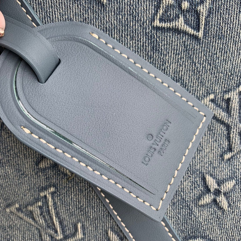 URBAN DENIM MONOGRAM EXPEDITION DUFFEL WITH EMBOSSED TEXTURE AND AZURE LEATHER TRIM