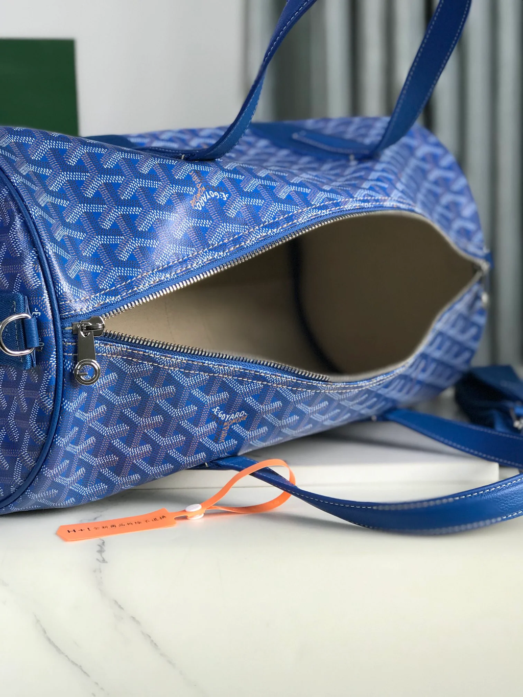 ROYAL AZURE CHEVRON BARREL DUFFEL WITH MONOCHROMATIC LEATHER ACCENTS