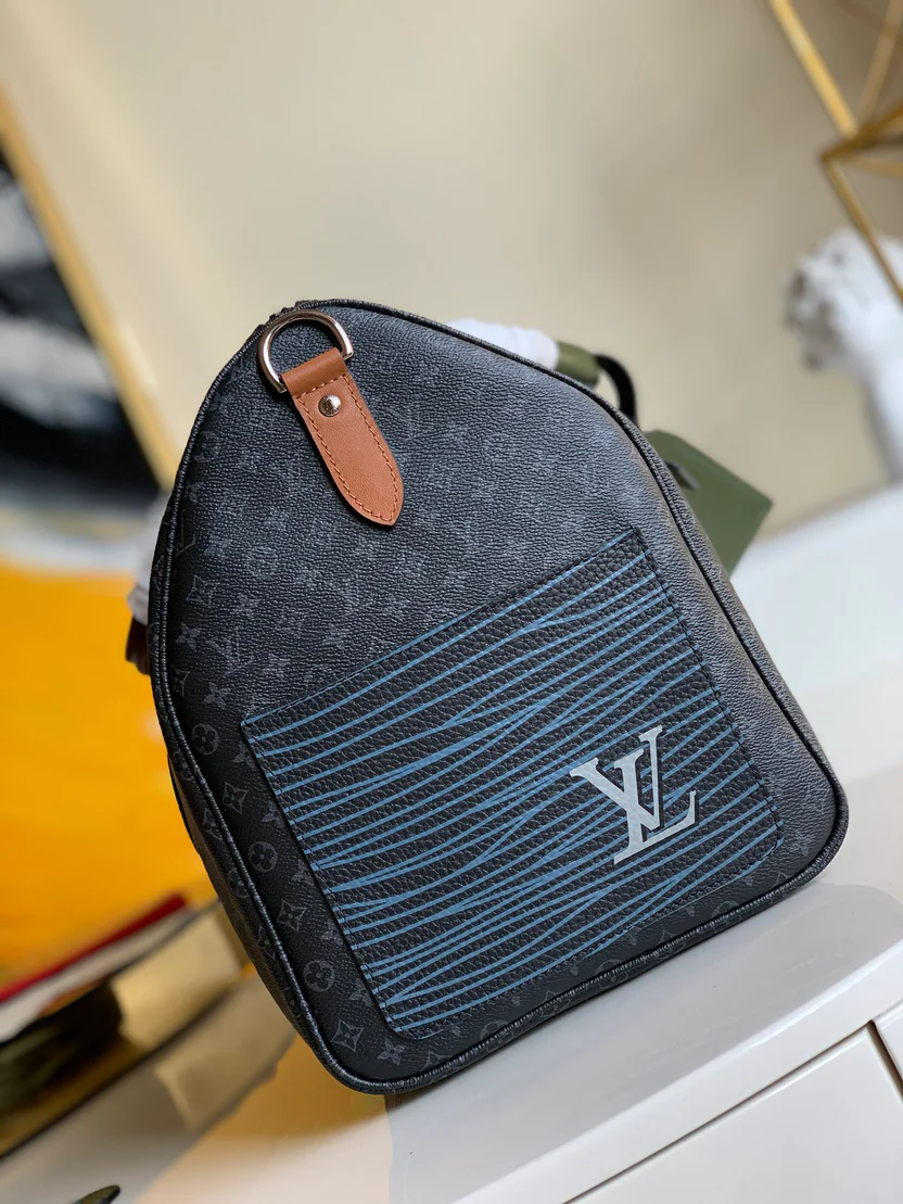 MODERN MONOGRAM GRAPHITE TRAVEL DUFFEL WITH MULTI-TONE ACCENTS