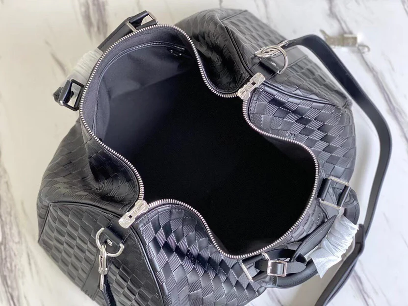 PREMIUM CHECKERED EBONY TRAVEL DUFFEL WITH REINFORCED LEATHER TRIM