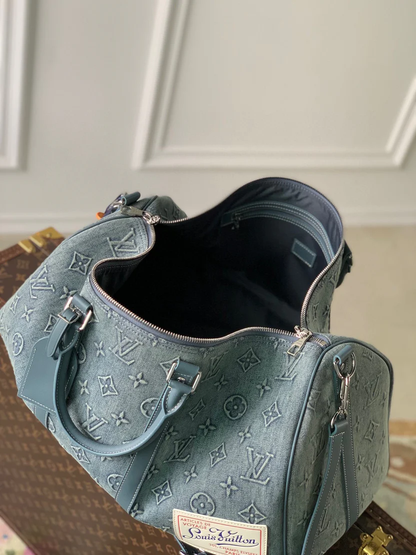 URBAN DENIM MONOGRAM EXPEDITION DUFFEL WITH EMBOSSED TEXTURE AND AZURE LEATHER TRIM