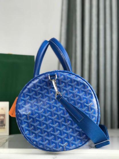 ROYAL AZURE CHEVRON BARREL DUFFEL WITH MONOCHROMATIC LEATHER ACCENTS
