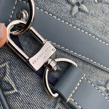 URBAN DENIM MONOGRAM EXPEDITION DUFFEL WITH EMBOSSED TEXTURE AND AZURE LEATHER TRIM