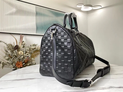 PREMIUM CHECKERED EBONY TRAVEL DUFFEL WITH REINFORCED LEATHER TRIM