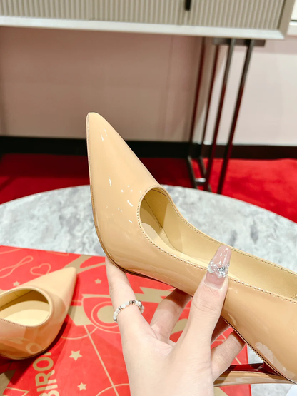ELEGANT NUDE POINTED-TOE PUMPS WITH REFINED SLANTED HIGH HEEL AND MINIMALIST SILHOUETTE